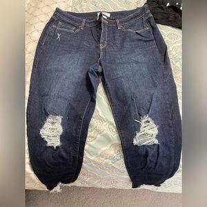 Jeans with rips and shark bite ankles